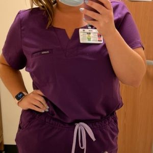 Jaanuu 1-Pocket Tuck-In Scrub Top in Eggplant